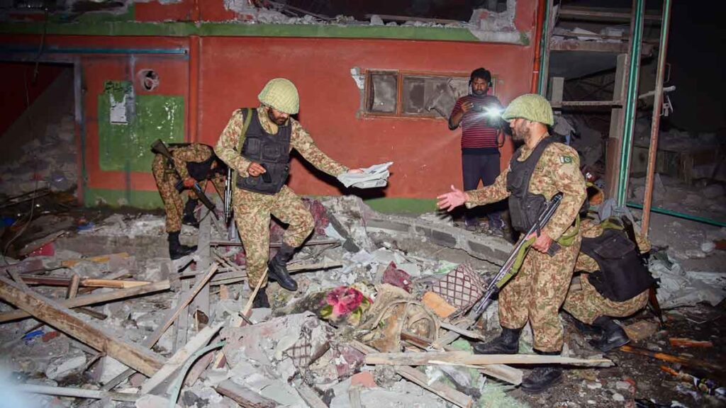 Army soldiers inspect a building damaged by a suspected Indian missile attack near Muzaffarabad, the capital of Pakistan controlled Kashmir | AP/PTI